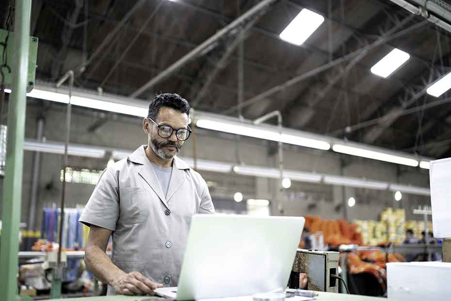 Shop Worker On Laptop